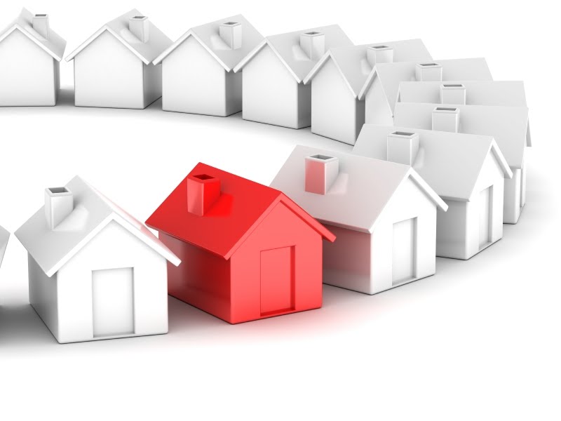 A red house among white houses